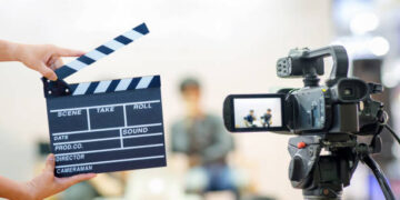 Man hands holding movie clapper.Film director concept.camera show viewfinder image catch motion in interview or broadcast wedding ceremony, catch feeling, stopped motion in best memorial day concept.